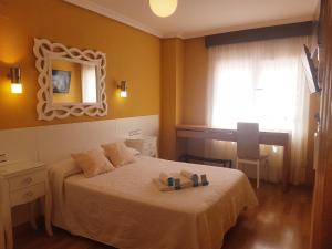 Posteľ alebo postele v izbe v ubytovaní Hotel Principe