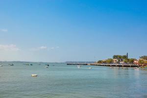 a large body of water with boats in it at The Hawaii Comforts Panjim in Panaji
