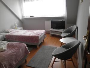 Postel nebo postele na pokoji v ubytování Apartament Esja