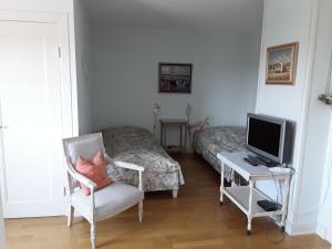 TV a/nebo společenská místnost v ubytování Gästehaus am Alten Hafen