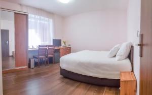 Postel nebo postele na pokoji v ubytování Apartment De Luna