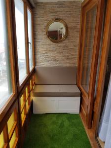 a small room with a bench and a mirror at Tazones CASA AURO VUT1198AS centrico y con vistas al mar in Tazones