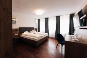 Postel nebo postele na pokoji v ubytování Hotel Weisser Bock