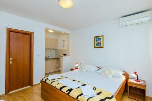 Ein Bett oder Betten in einem Zimmer der Unterkunft Guesthouse Matusic