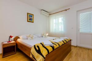 Ein Bett oder Betten in einem Zimmer der Unterkunft Guesthouse Matusic