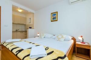 Ein Bett oder Betten in einem Zimmer der Unterkunft Guesthouse Matusic
