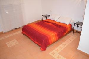 Letto o letti in una camera di Casa Naima