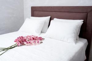 A bed or beds in a room at IPN APARTMENTs
