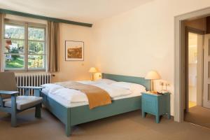 Ένα ή περισσότερα κρεβάτια σε δωμάτιο στο Hotel Tre Cime Sesto - Sexten