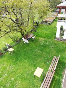 an overhead view of a park with benches in a yard at Haus Marion in Jerzens