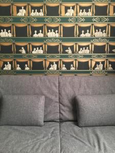 a wall with a shelf with figurines on it at APARTHOTEL CASA MIA in Milan