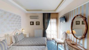 Rúm í herbergi á Hotel Mirto