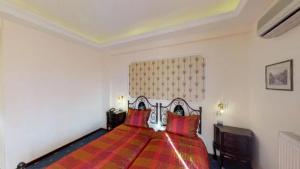 Rúm í herbergi á Hotel Mirto