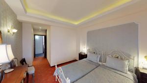 Rúm í herbergi á Hotel Mirto