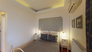 Rúm í herbergi á Hotel Mirto