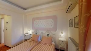 Rúm í herbergi á Hotel Mirto