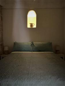 Postel nebo postele na pokoji v ubytování Le Petunie