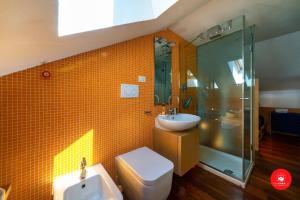 a bathroom with a sink and a toilet and a shower at La Casa dagli Occhi Blu in Portovenere +33 photos
