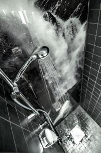 a shower with a faucet in a bathroom at Myrkdalen Resort Hotel in Myrkdalen +16 photos