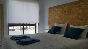 Postel nebo postele na pokoji v ubytování Sun House - Baleal