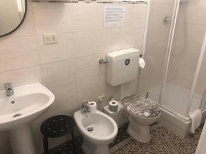 A bathroom at Check-Inn Rooms Genova Centro