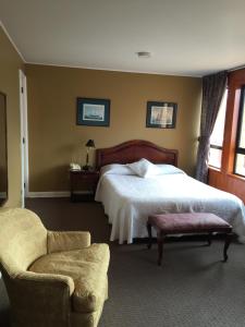 Postel nebo postele na pokoji v ubytování Hotel Apart Colón