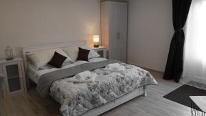 a bedroom with a bed with two people on it at Huncovská 14 in Košice