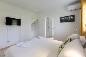 Voodi või voodid majutusasutuse Villas Rock & Beach toas