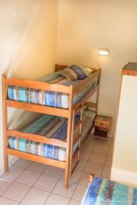 a bedroom with two bunk beds in a room at Sunset Bay Club & SeaSide Dive Resort in Salisbury