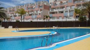 an empty swimming pool in front of a building at Puerto Rey Vera Mar in Vera