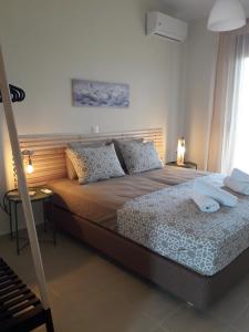 Postel nebo postele na pokoji v ubytování Aelia Villa