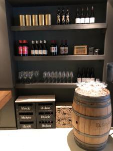 a wine tasting room with a barrel and wine glasses at Het Weeshuis in Bolsward