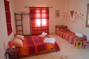 Letto o letti in una camera di Casa Naima