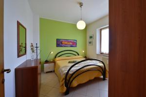 A bed or beds in a room at Residence Verde Quiete