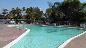 a swimming pool with a slide in the middle at Hotel Campestre Luna Roja in Puerto López
