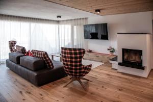 Televízia a/alebo spoločenská miestnosť v ubytovaní Penthouse Chalet Pichlerhof