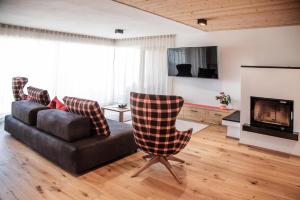 Televízia a/alebo spoločenská miestnosť v ubytovaní Penthouse Chalet Pichlerhof