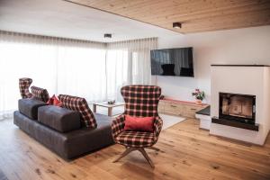 Televízia a/alebo spoločenská miestnosť v ubytovaní Penthouse Chalet Pichlerhof