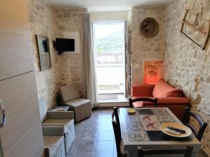 a living room with a couch and a table at Antico Mercato in Ragusa