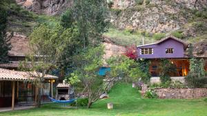 a house in front of a mountain at Casa de La Chola in Ollantaytambo