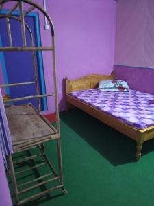 Een bed of bedden in een kamer bij VAMOOSE CHAMLING