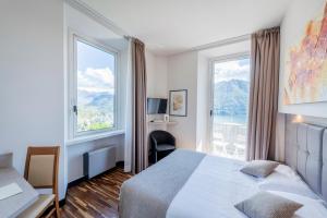 Postel nebo postele na pokoji v ubytování Hotel Asnigo + 37 fotografií