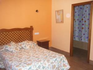 Posteľ alebo postele v izbe v ubytovaní Hostal Muriel