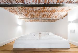 Posteľ alebo postele v izbe v ubytovaní Old Time Apartments