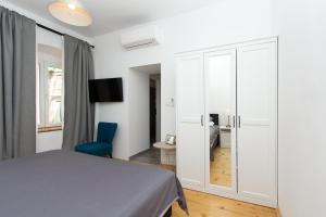Postel nebo postele na pokoji v ubytování Apartments and Rooms Ille