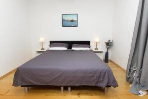 Postel nebo postele na pokoji v ubytování Apartments and Rooms Ille