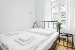 Posteľ alebo postele v izbe v ubytovaní Old Time Apartments