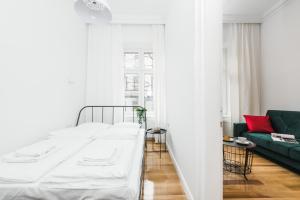 Posteľ alebo postele v izbe v ubytovaní Old Time Apartments