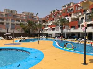 a large swimming pool in a resort with buildings at Puerto Rey Vera Mar in Vera