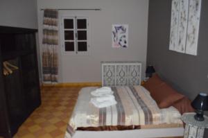 Letto o letti in una camera di Casa Naima